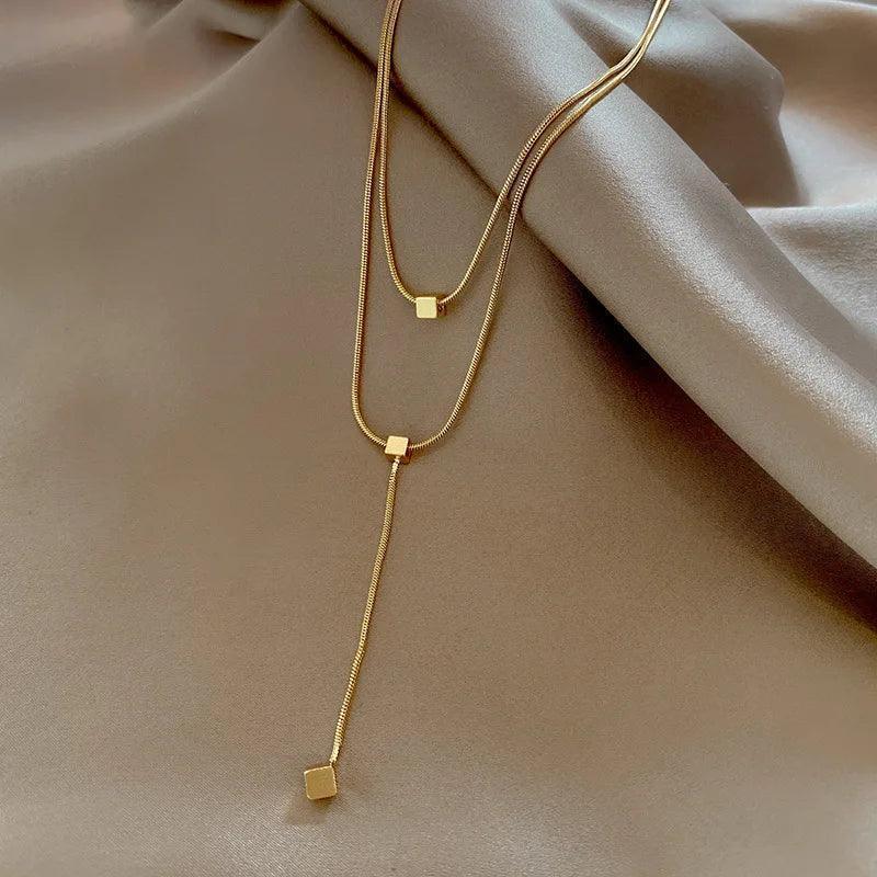 Colar Dourado Geométrico de Camadas com Tassel em Aço Inoxidável - Ravelle Luxe