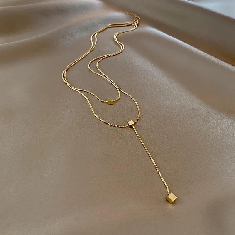 Colar Dourado Geométrico de Camadas com Tassel em Aço Inoxidável - Ravelle Luxe