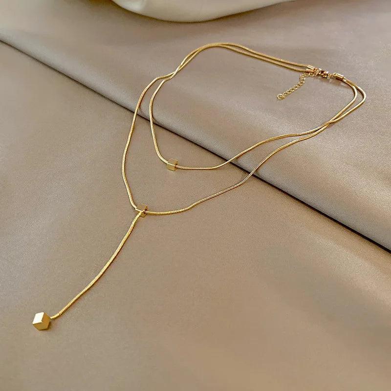 Colar Dourado Geométrico de Camadas com Tassel em Aço Inoxidável - Ravelle Luxe