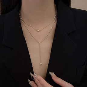 Colar Dourado Geométrico de Camadas com Tassel em Aço Inoxidável - Ravelle Luxe
