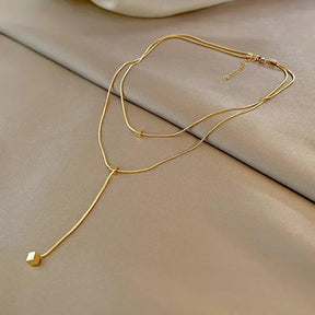 Colar Dourado Geométrico de Camadas com Tassel em Aço Inoxidável - Ravelle Luxe