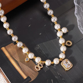 Conjunto de Colar e Pulseira com Pingente Quadrado de Zircônia e Conchas Brancas Banhado a Ouro - Ravelle Luxe