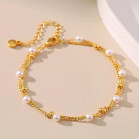 Pulseira Dourada de Dupla Cadeia com Pérolas e Banhada em Ouro 18K - Ravelle Luxe