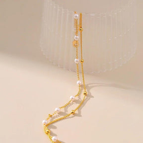 Pulseira Dourada de Dupla Cadeia com Pérolas e Banhada em Ouro 18K - Ravelle Luxe